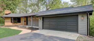 ranch home with dark gray garage door