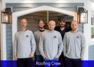roofing crew against exterior display background
